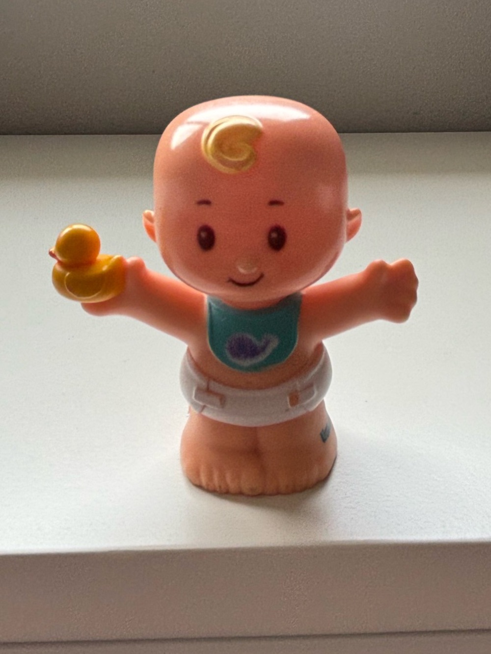 Little people baby with a duck